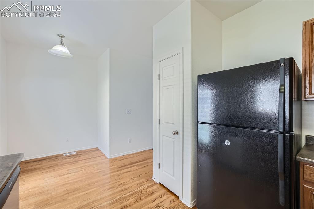 10581 Wells Point Fountain, CO 80817 - Photo 10 of 23 a view of empty room with wooden floor