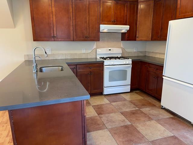 36733 Olive Street Newark, CA 94560 - Photo 4 of 16 a kitchen with a sink a stove and cabinets