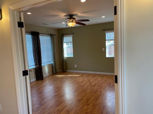 36733 Olive Street Newark, CA 94560 - Photo 7 of 16 wooden floor in an empty room with a window