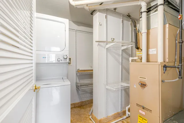 a bathroom with a sink and a refrigerator