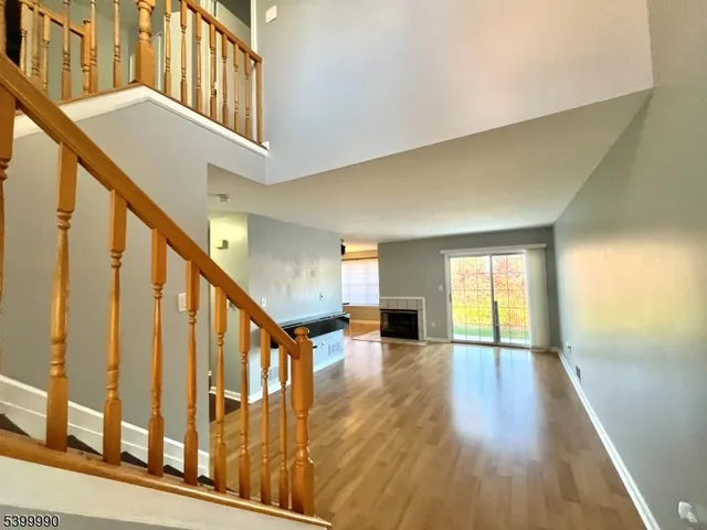 a view of an entryway with wooden floor