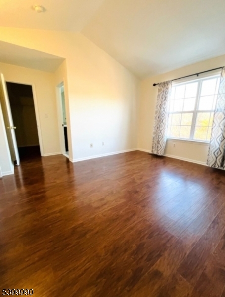 15 Weatherhill Road Hamburg, NJ 07419 - Photo 5 of 13 an empty room with wooden floor and windows