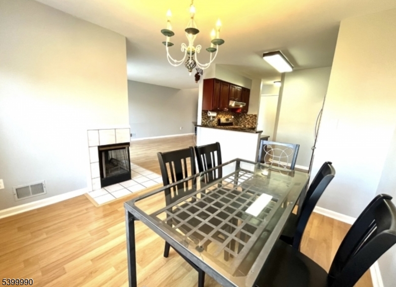 15 Weatherhill Road Hamburg, NJ 07419 - Photo 6 of 13 a view of a dining room with furniture and a chandelier