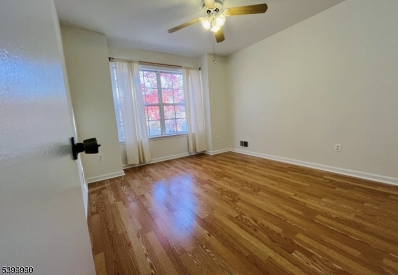 15 Weatherhill Road Hamburg, NJ 07419 - Photo 8 of 13 wooden floor in an empty room with a window