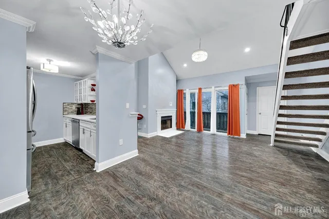 a view of a kitchen with a sink and cabinets