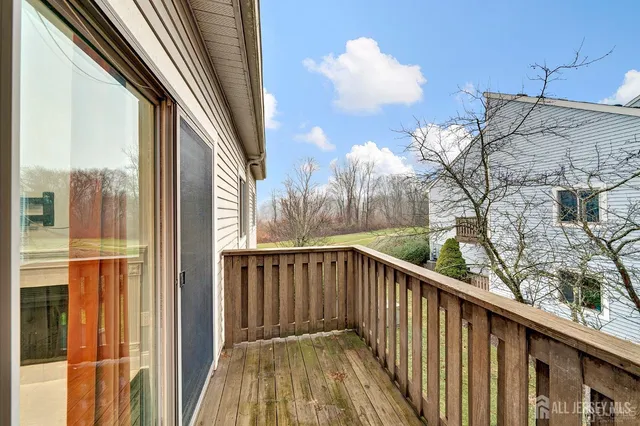 a view of balcony with wooden floor