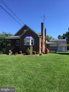 1829 Middleborough Road Baltimore, MD 21221 - Photo 1 of 20 a front view of a house with a garden