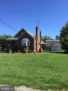 1829 Middleborough Road Baltimore, MD 21221 - Photo 2 of 20 a front view of a house with a garden and yard