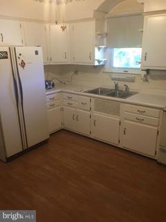 1829 Middleborough Road Baltimore, MD 21221 - Photo 11 of 20 a kitchen with cabinets and window