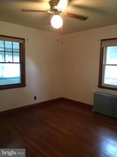 1829 Middleborough Road Baltimore, MD 21221 - Photo 13 of 20 an empty room with wooden floor and windows