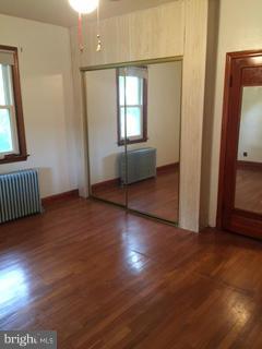 1829 Middleborough Road Baltimore, MD 21221 - Photo 14 of 20 an empty room with wooden floor and windows