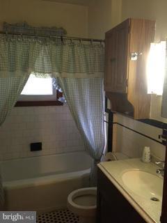 1829 Middleborough Road Baltimore, MD 21221 - Photo 17 of 20 a bathroom with a sink toilet and window
