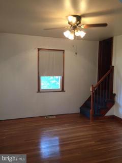 1829 Middleborough Road Baltimore, MD 21221 - Photo 8 of 20 a view of a room with wooden floor fan and window