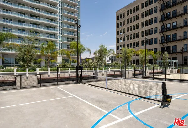 a view of a patio with table and chairs