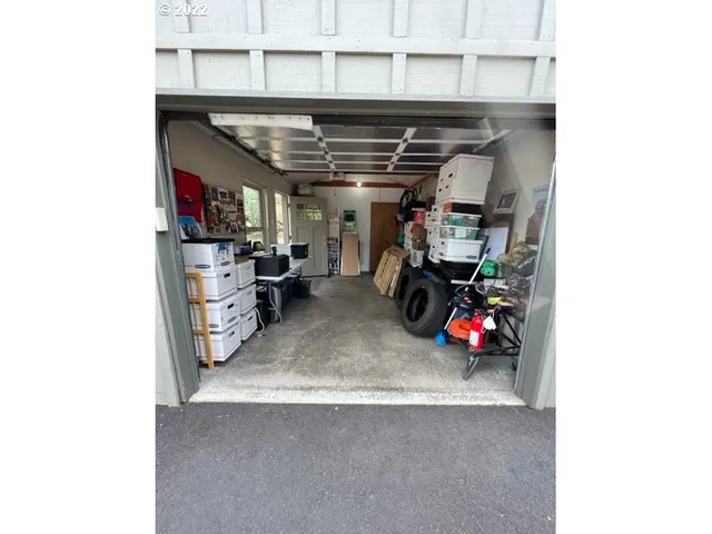 a view of a room with rack and windows