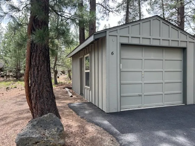 a view of a house with a large tree