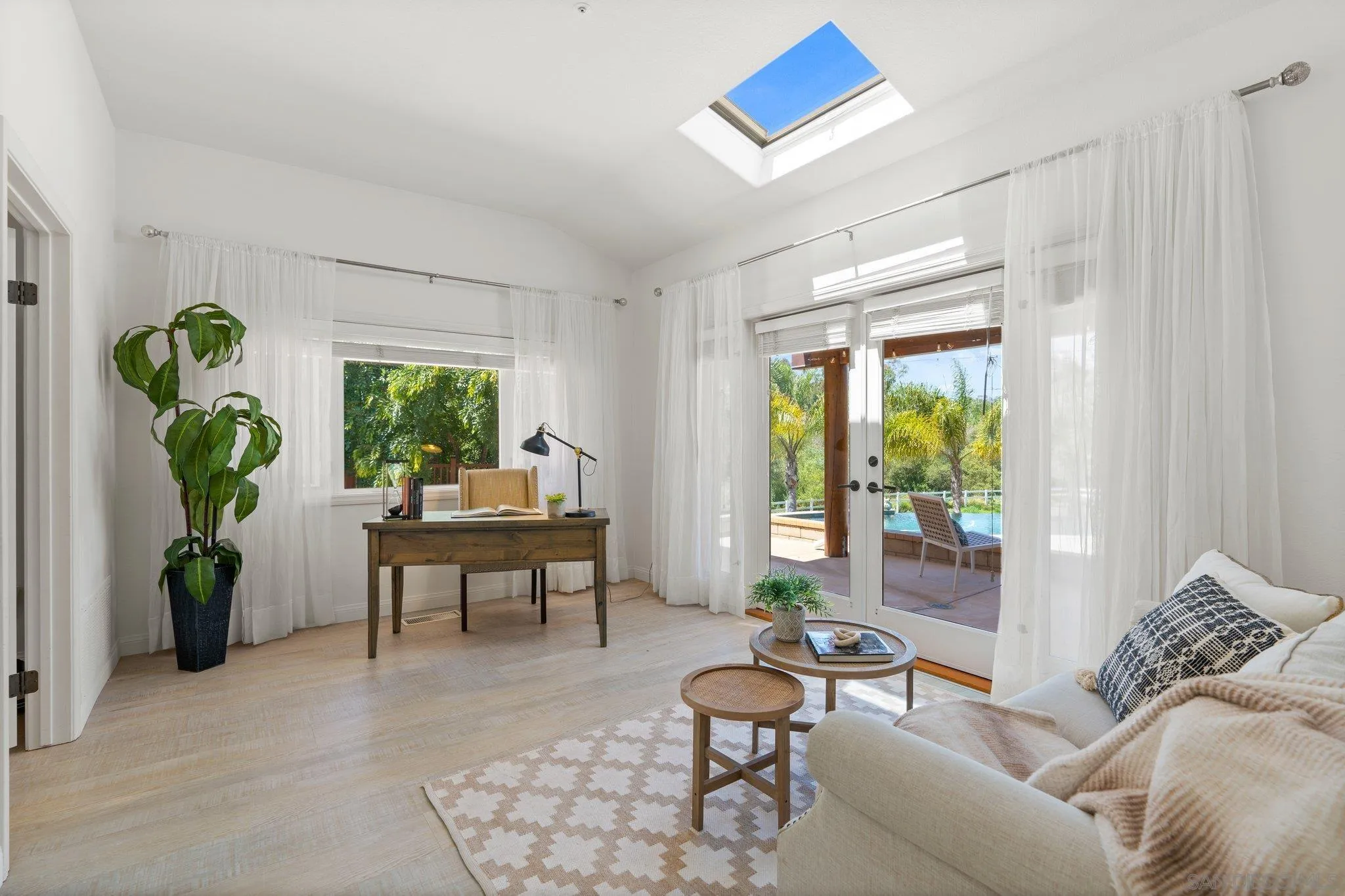 3111 Brookside Lane Encinitas, CA 92024 - Photo 14 of 40 a living room with furniture and a window