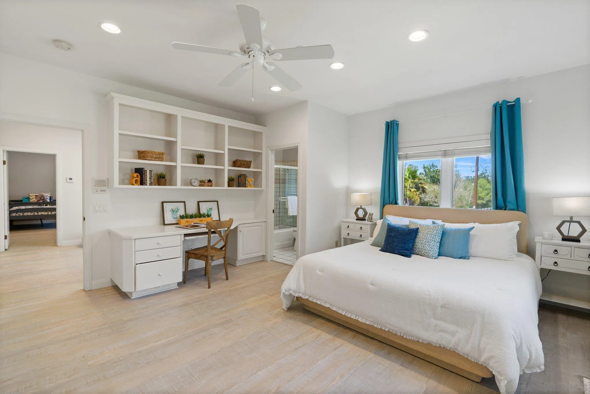 3111 Brookside Lane Encinitas, CA 92024 - Photo 16 of 40 a bedroom with a large bed and furniture