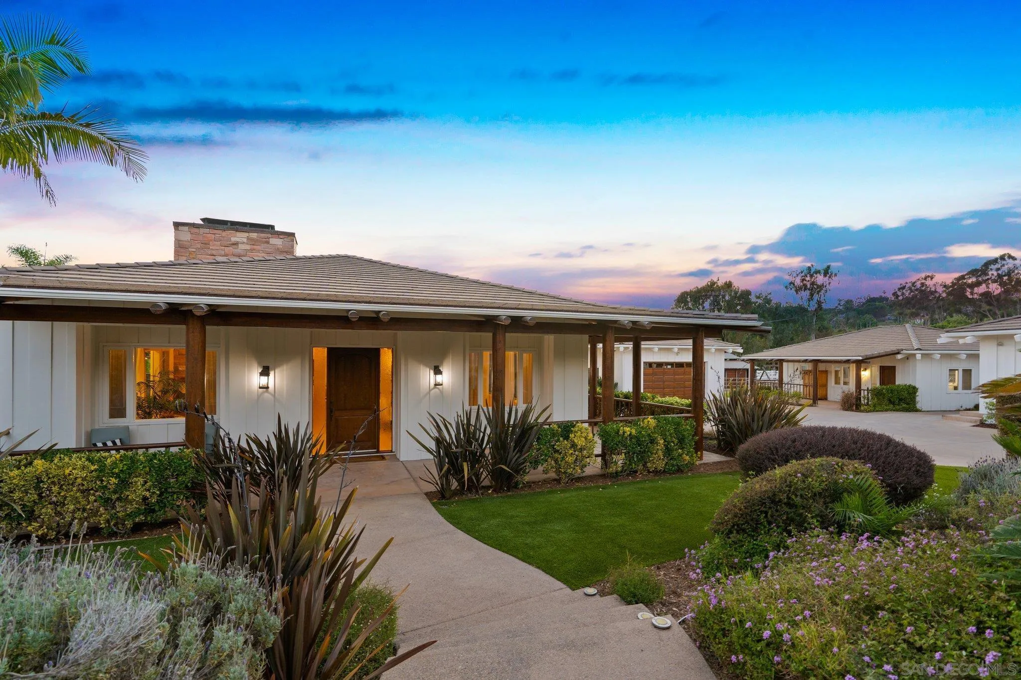 3111 Brookside Lane Encinitas, CA 92024 - Photo 3 of 40 a front view of a house with a yard