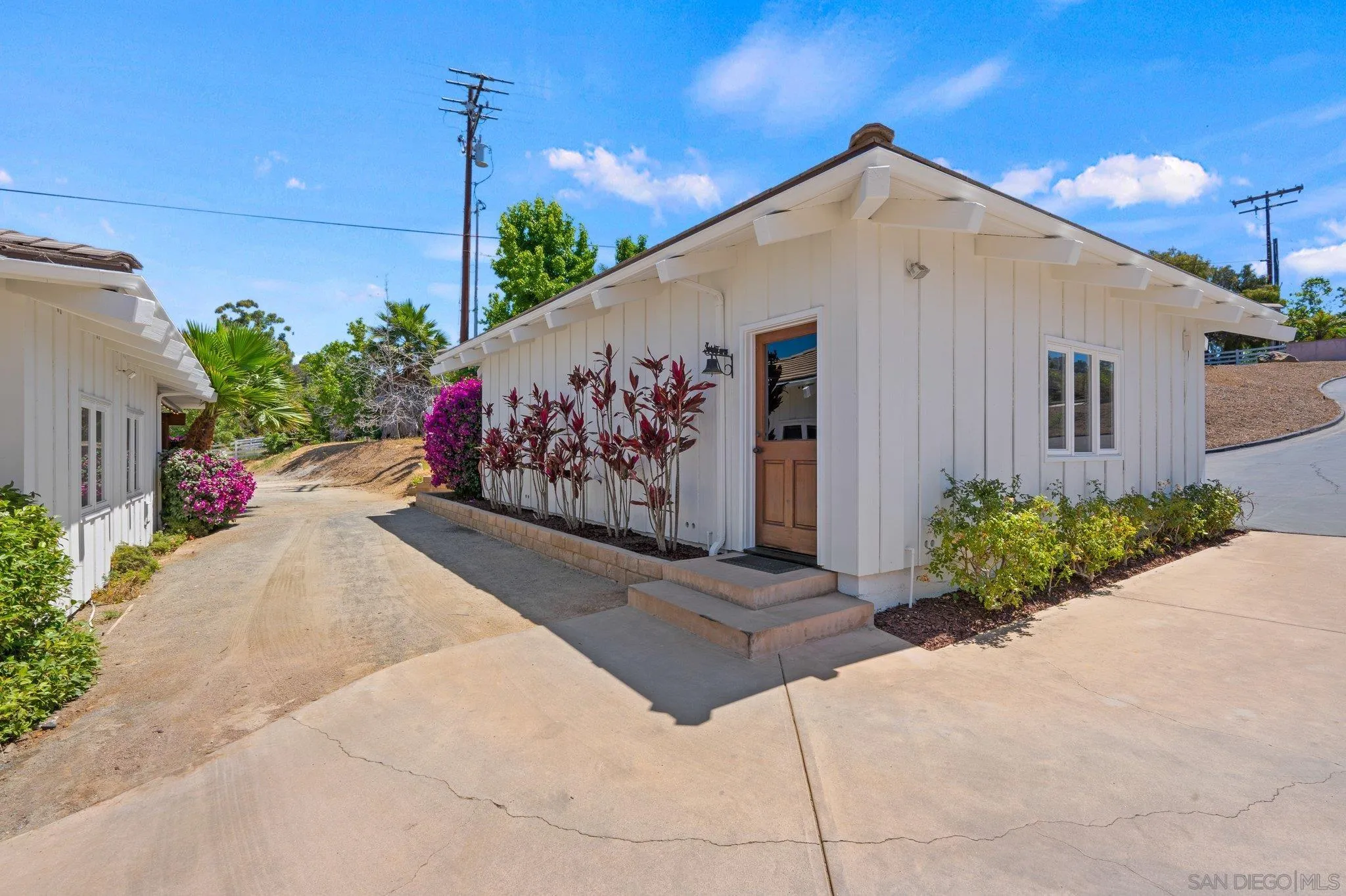 3111 Brookside Lane Encinitas, CA 92024 - Photo 36 of 40 a front view of a house with a yard and a garage
