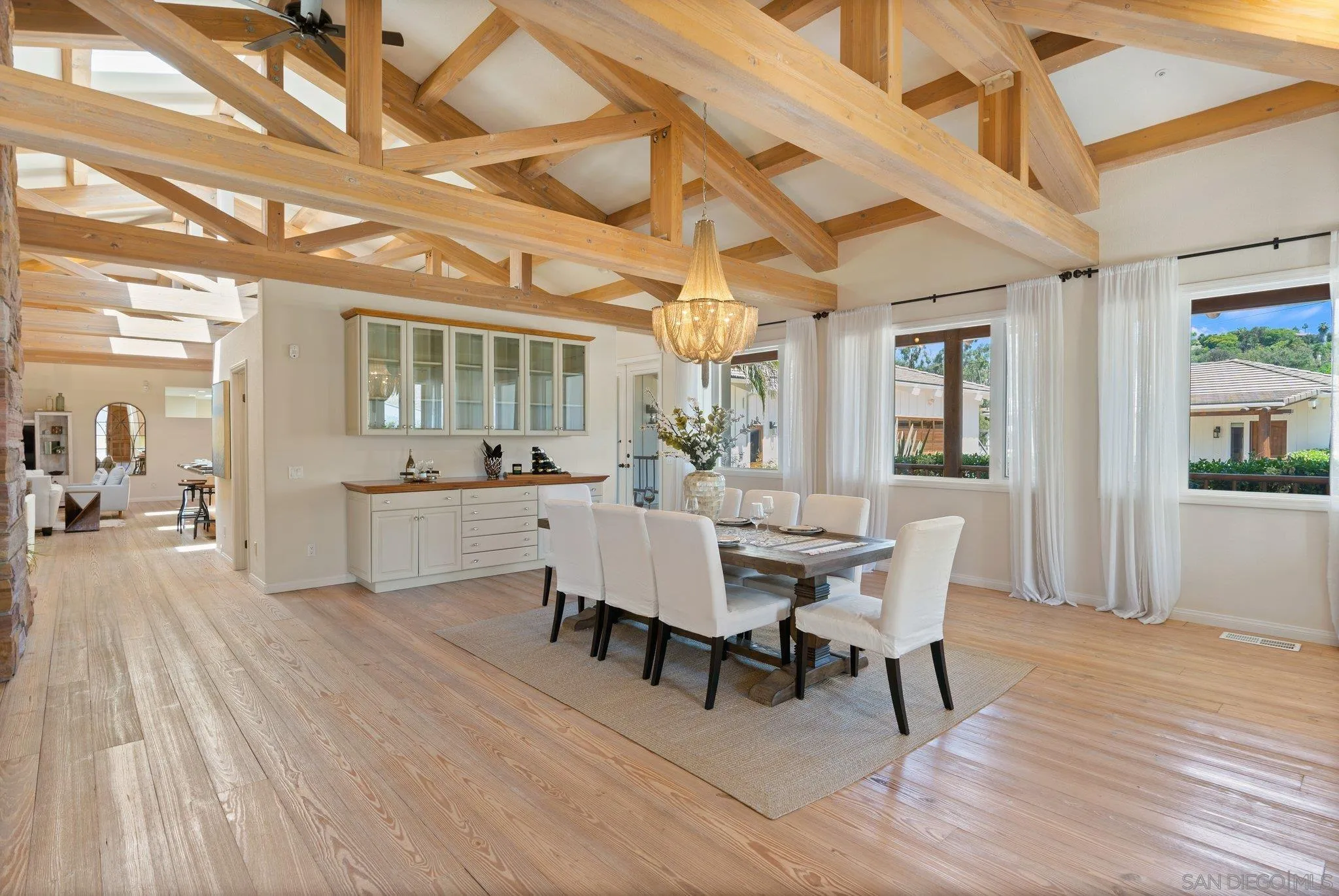 3111 Brookside Lane Encinitas, CA 92024 - Photo 5 of 40 a view of a dining room with furniture and wooden floor