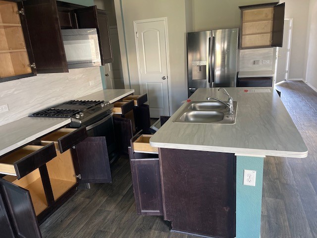 23318 Pelham Prairie Lane Spring, TX 77373 - Photo 3 of 14 a kitchen that has a sink and a stove