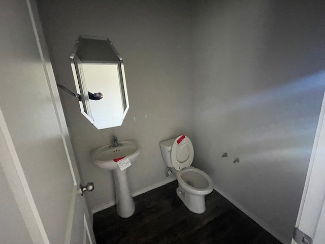 23318 Pelham Prairie Lane Spring, TX 77373 - Photo 4 of 14 a bathroom with a toilet sink and mirror