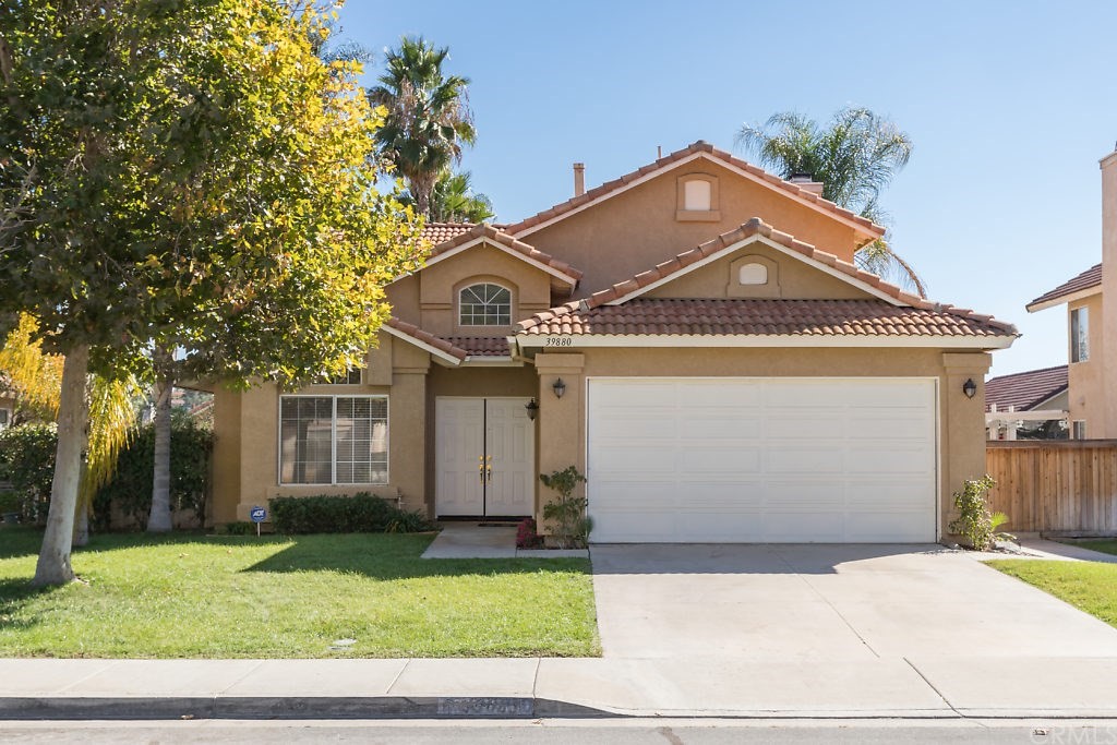 39880 North General Kearny Road Temecula, CA 92591 - Photo 1 of 1 a front view of a house with a garden