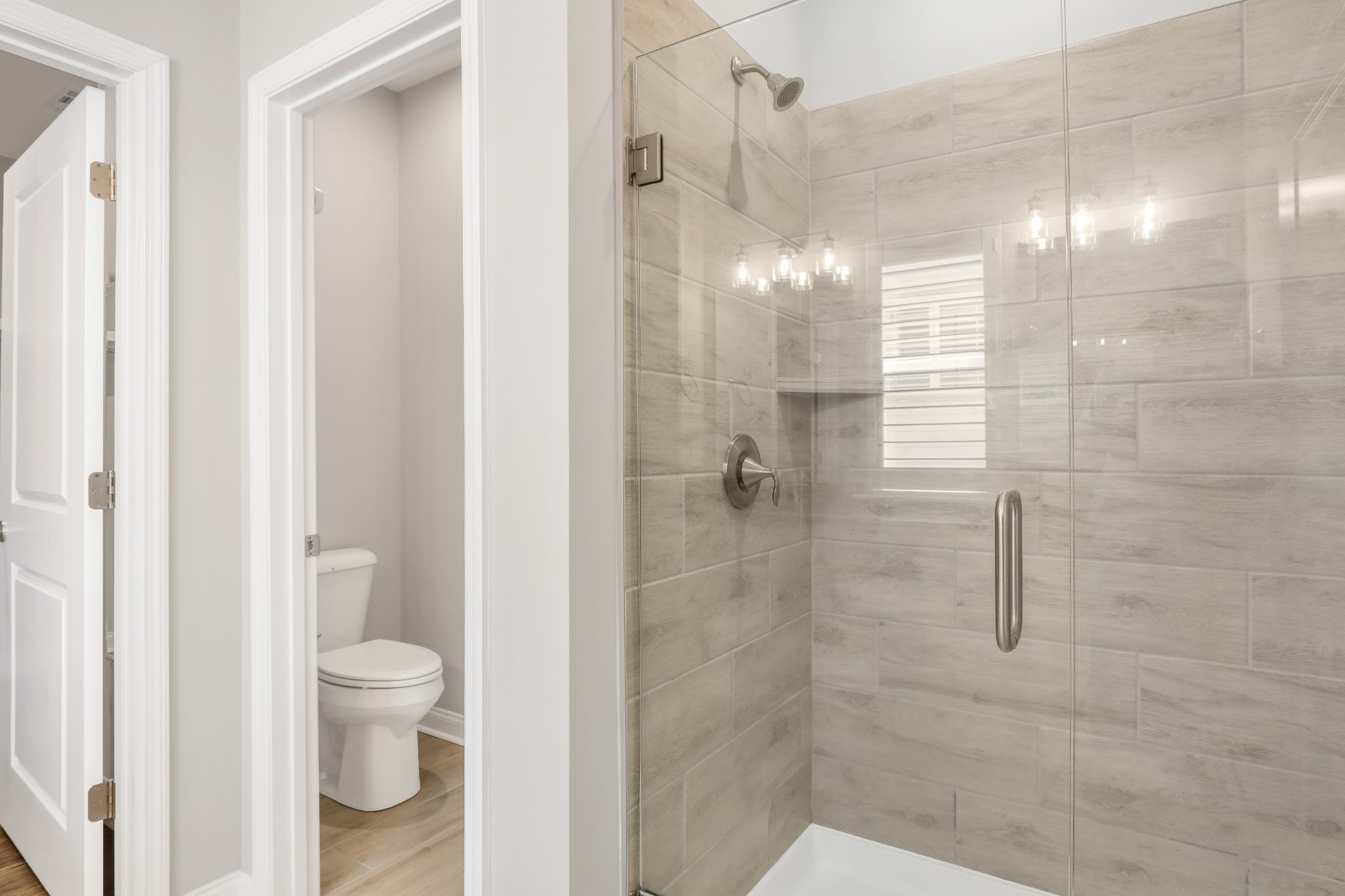 413 Meandering Way White House, TN 37188 - Photo 16 of 24 a bathroom with a shower and a toilet