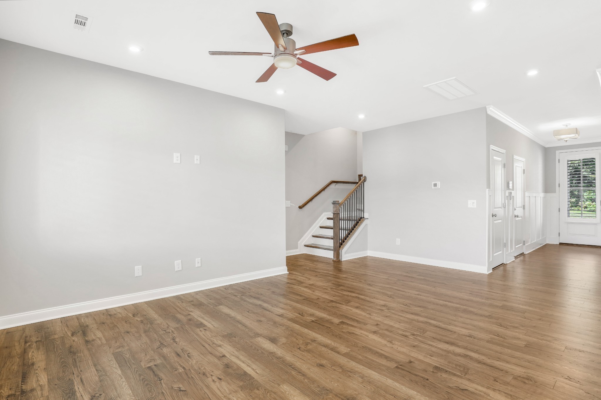 413 Meandering Way White House, TN 37188 - Photo 19 of 24 an empty room with wooden floor and a ceiling fan