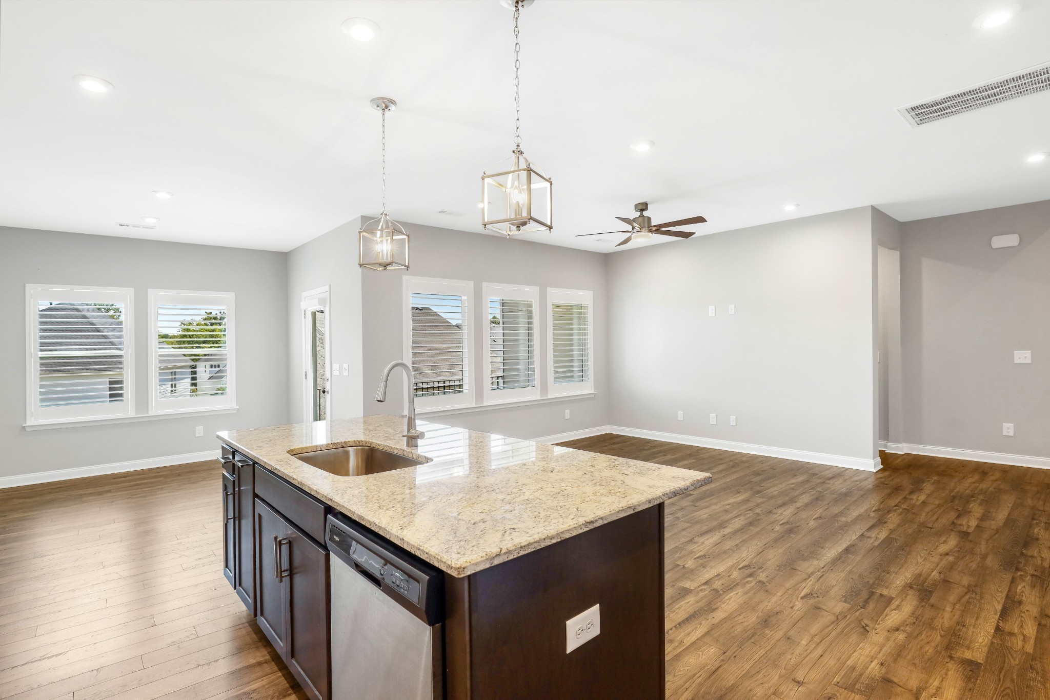 413 Meandering Way White House, TN 37188 - Photo 5 of 24 a kitchen with granite countertop a sink and a wooden floor