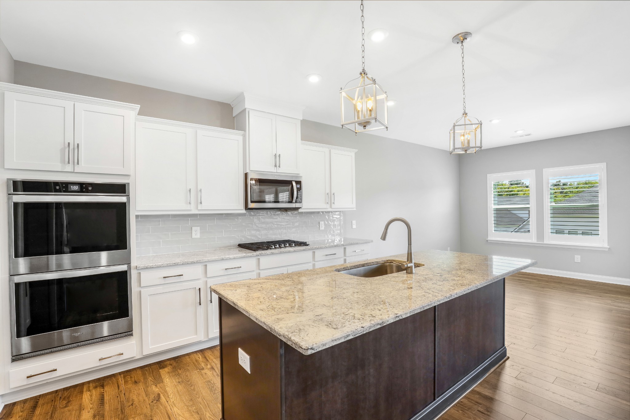 413 Meandering Way White House, TN 37188 - Photo 8 of 24 a kitchen with stainless steel appliances granite countertop a sink a stove a microwave a counter space and cabinets