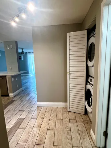 an entryway of a house with wooden floor