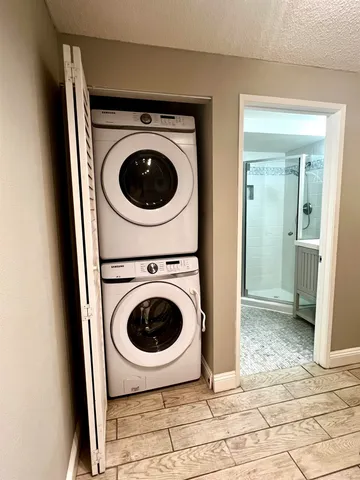 a view of a hallway with washer and dryer