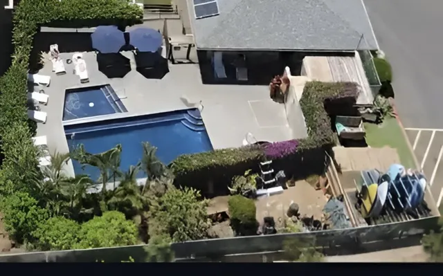 an aerial view of a house with outdoor space