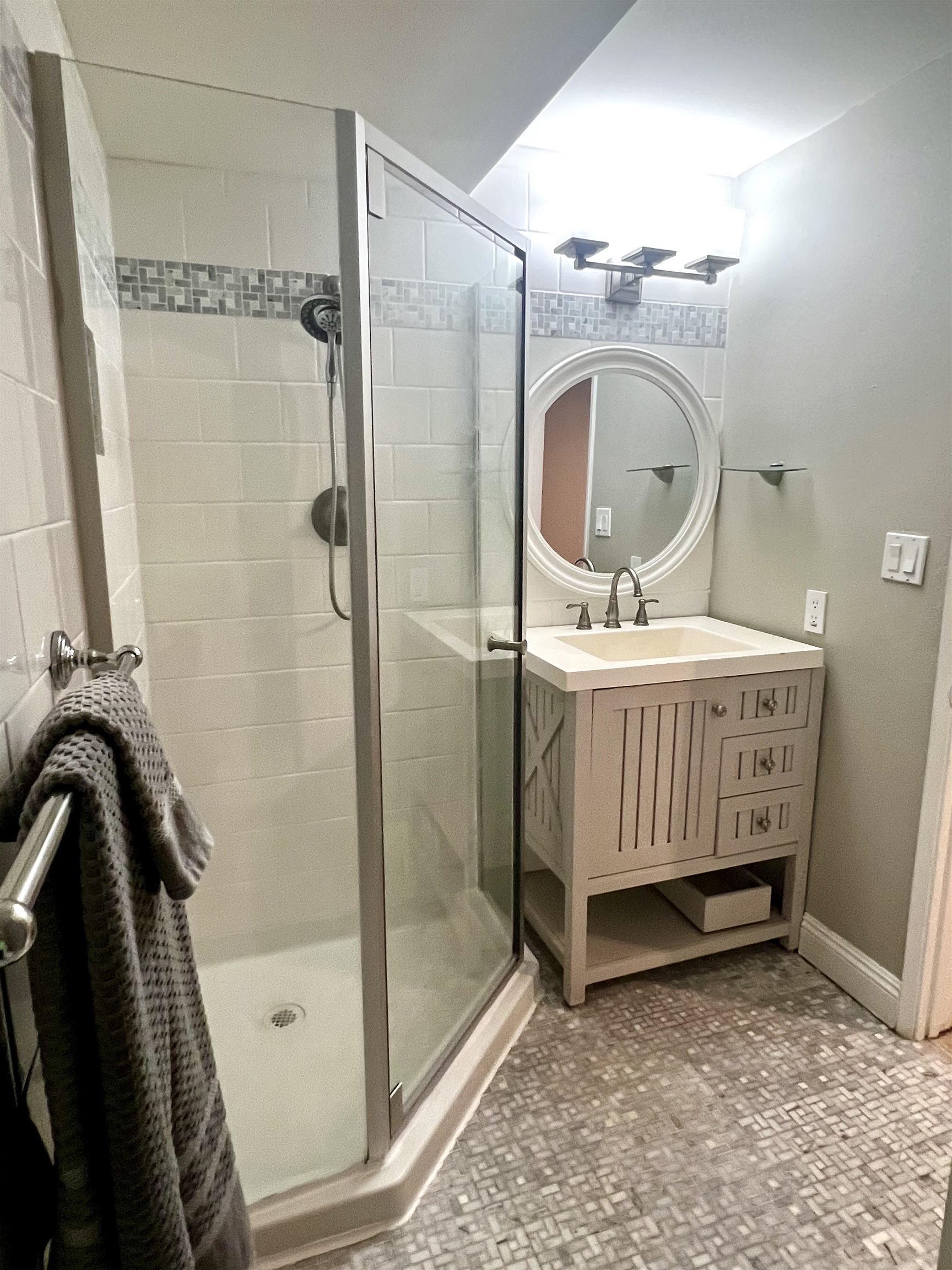 2747 South Kihei Road, Unit B101 Kihei, HI 96753 - Photo 22 of 38 a bathroom with a sink a mirror and a shower