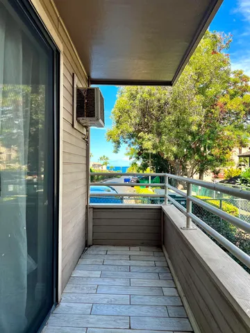 a view of balcony and kitchen