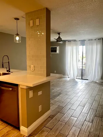 a view of a livingroom with furniture and a chandelier