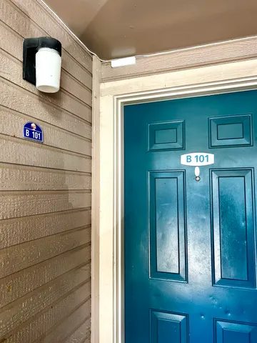 a view of a house with a street