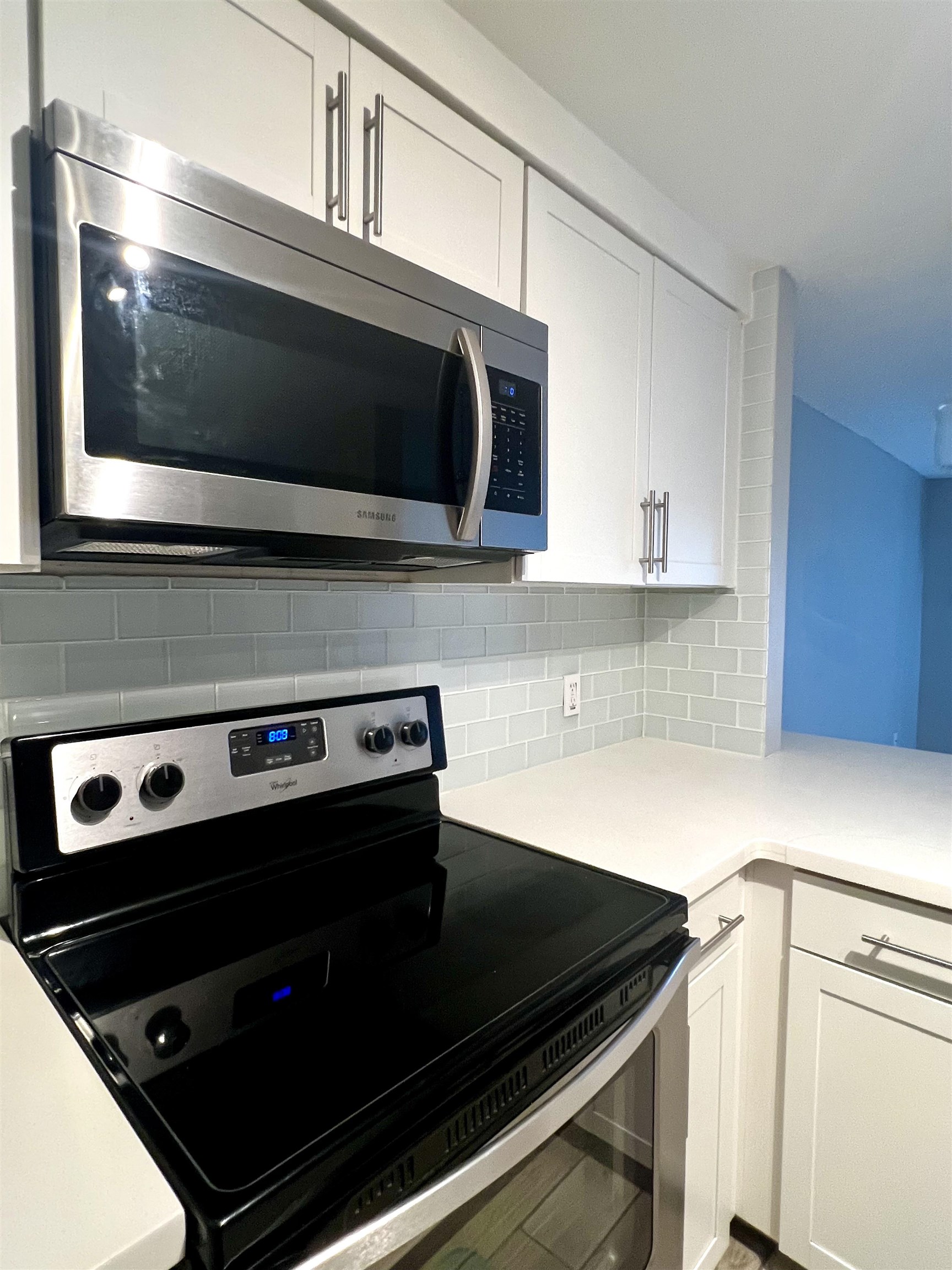 2747 South Kihei Road, Unit B101 Kihei, HI 96753 - Photo 6 of 38 a kitchen with a stove microwave and sink