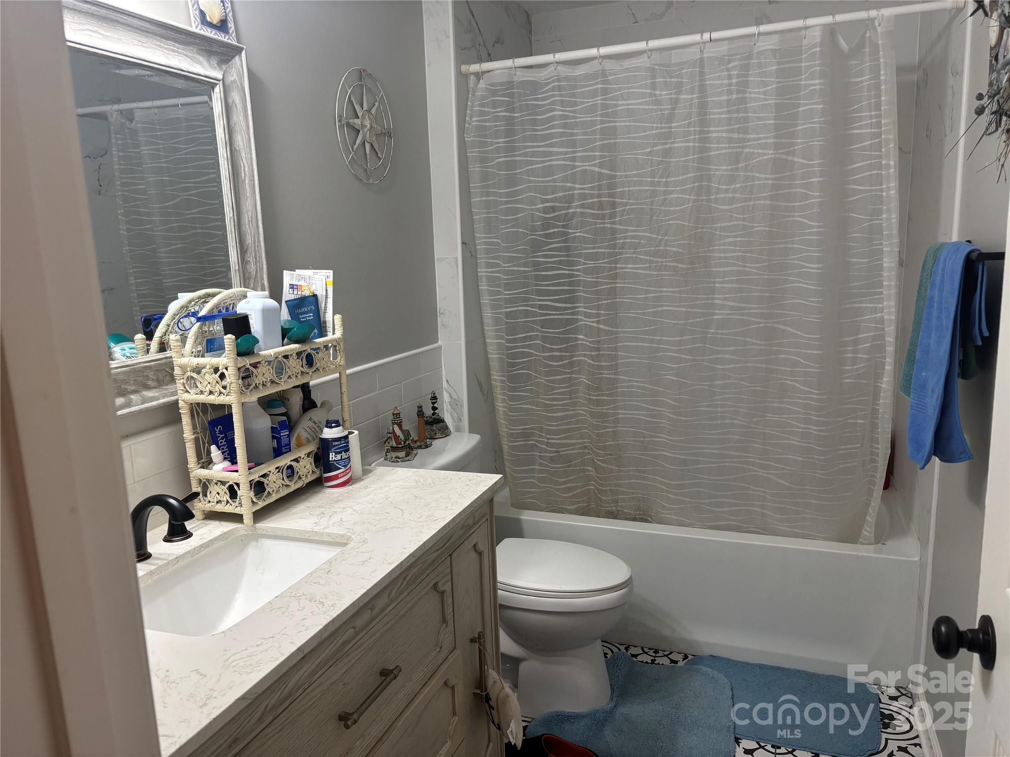 231 Browntown Road Belmont, NC 28012 - Photo 11 of 12 a bathroom with a sink a toilet and shower