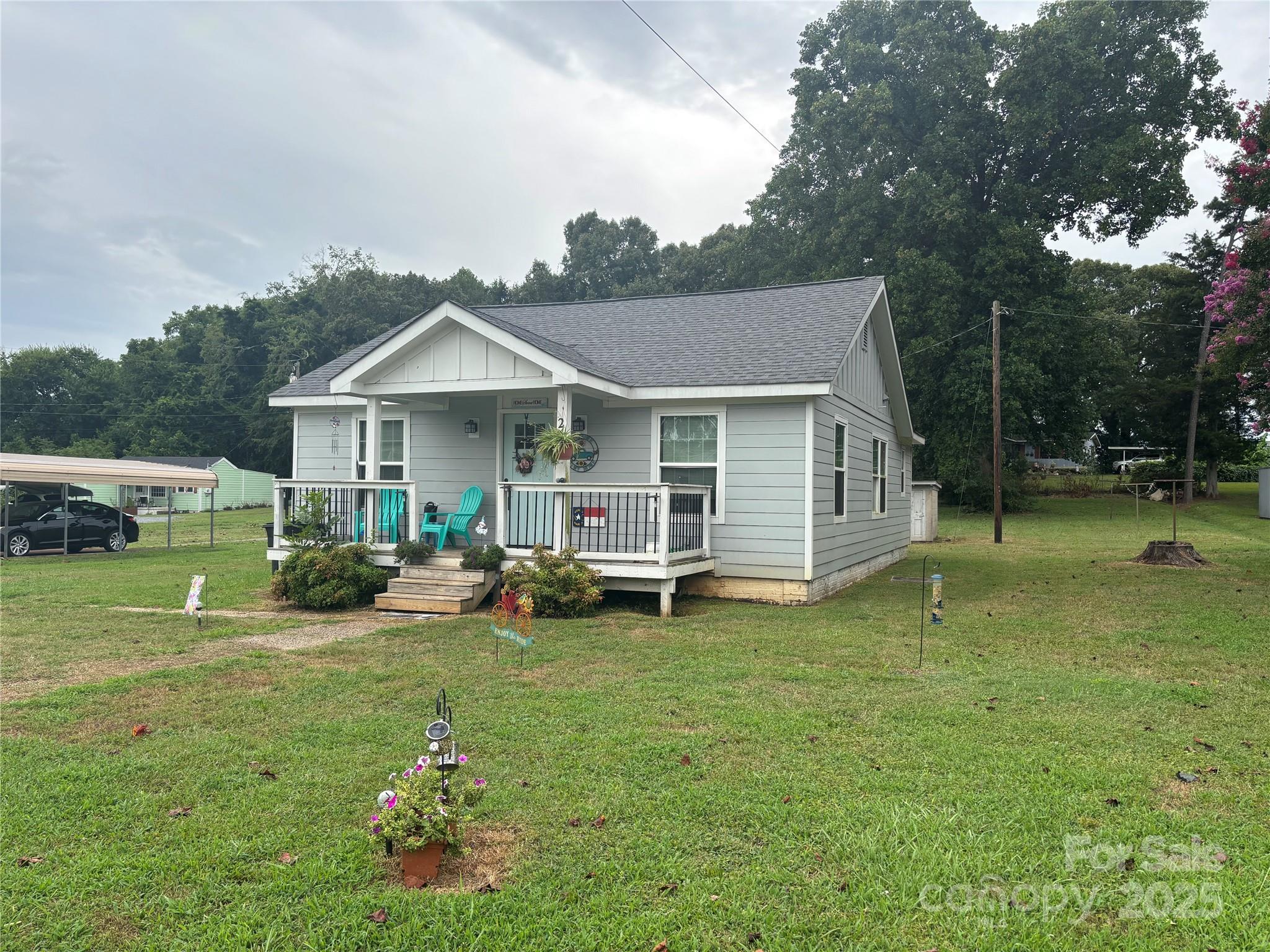 231 Browntown Road Belmont, NC 28012 - Photo 2 of 12 a view of a house with backyard porch and sitting area