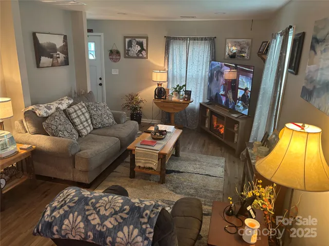 a living room with furniture and a flat screen tv