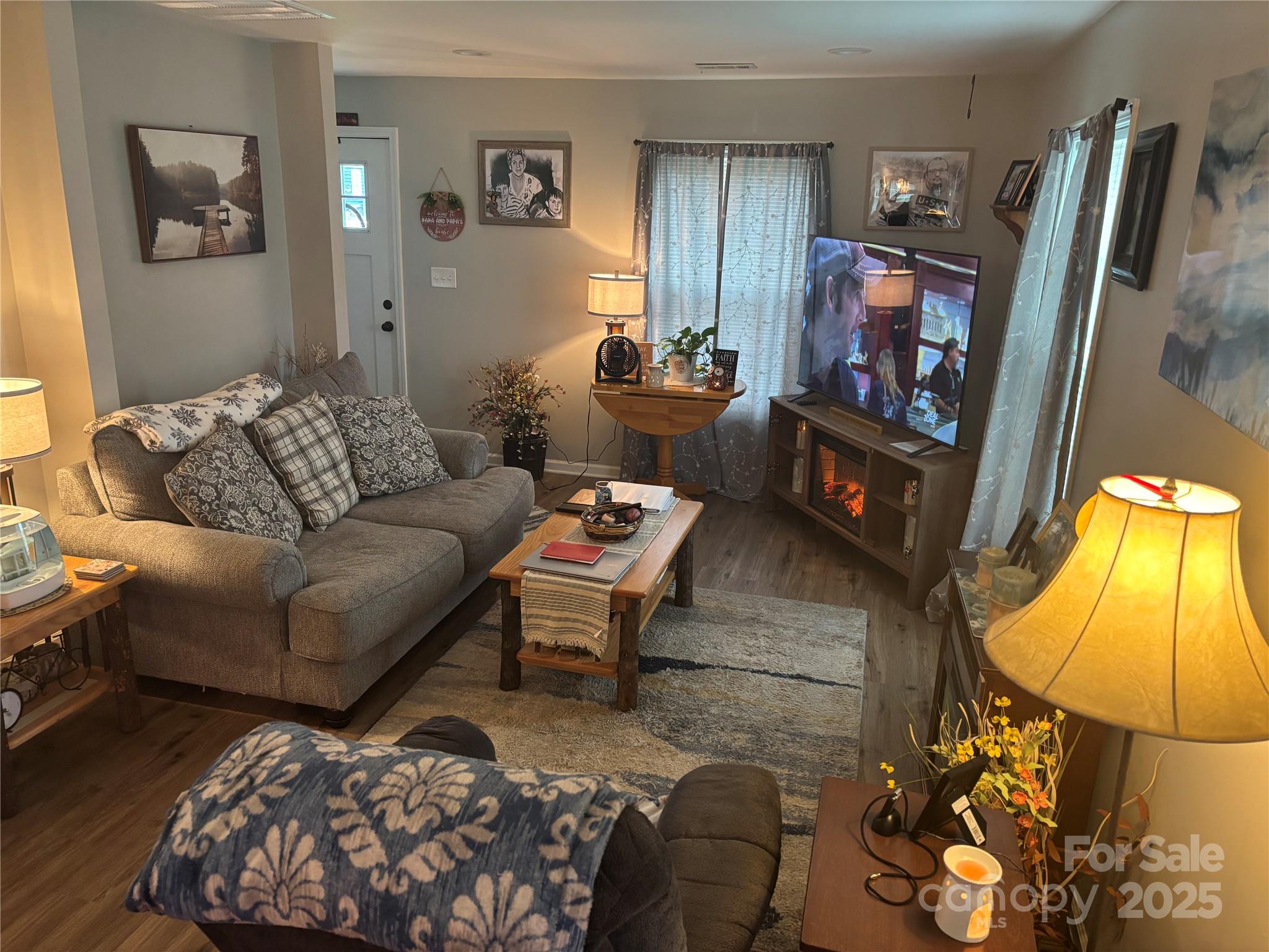 231 Browntown Road Belmont, NC 28012 - Photo 3 of 12 a living room with furniture and a flat screen tv