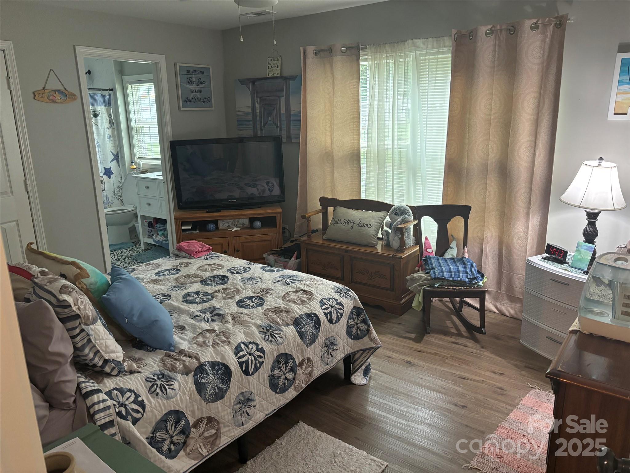 231 Browntown Road Belmont, NC 28012 - Photo 7 of 12 a bedroom with a bed and wooden floor