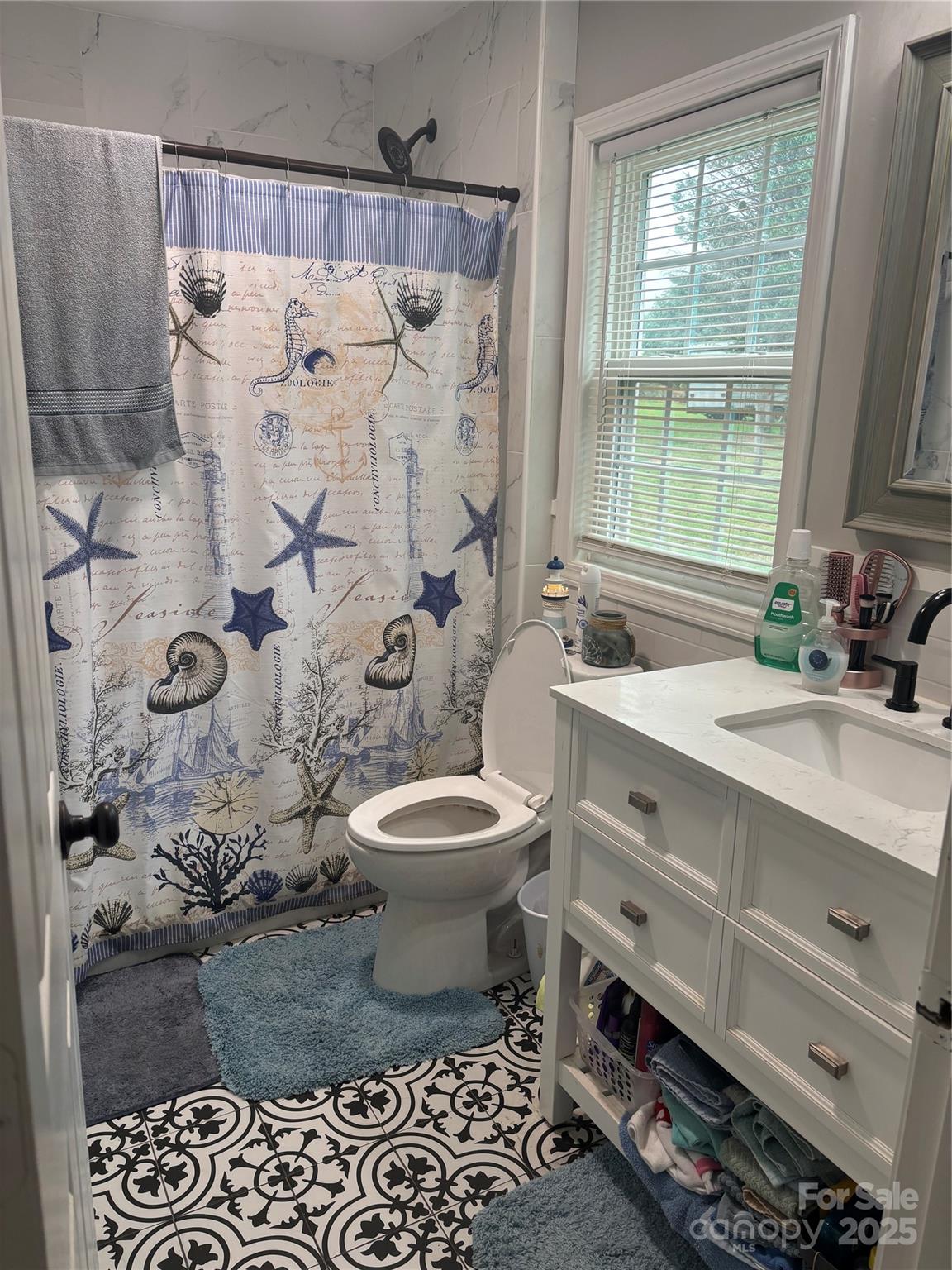 231 Browntown Road Belmont, NC 28012 - Photo 8 of 12 a bathroom with a sink toilet and shower