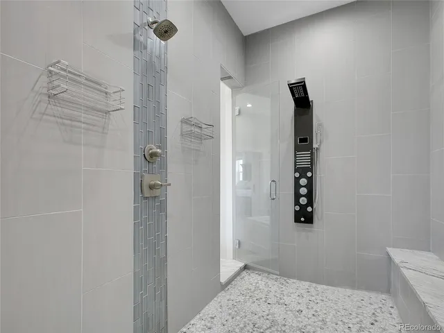 a bathroom with a shower and a sink