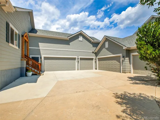 a house with trees in the background