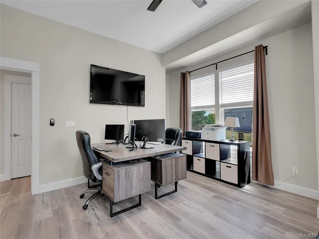 a bedroom with furniture and a window