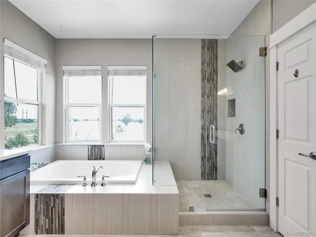 a kitchen with stainless steel appliances kitchen island granite countertop a table and chairs in it